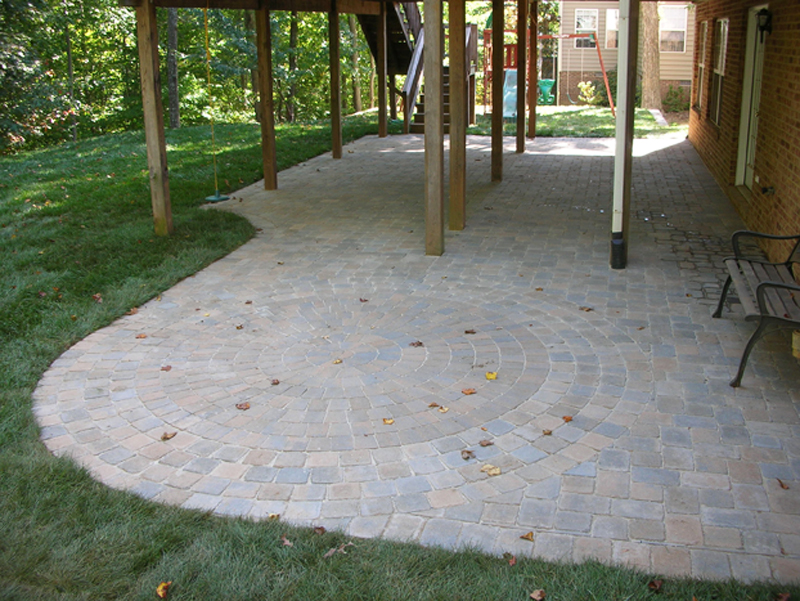 Paver patio creating usable space under deck